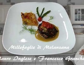 Millefoglie di melanzana e ombrina su salsa ai crostacei